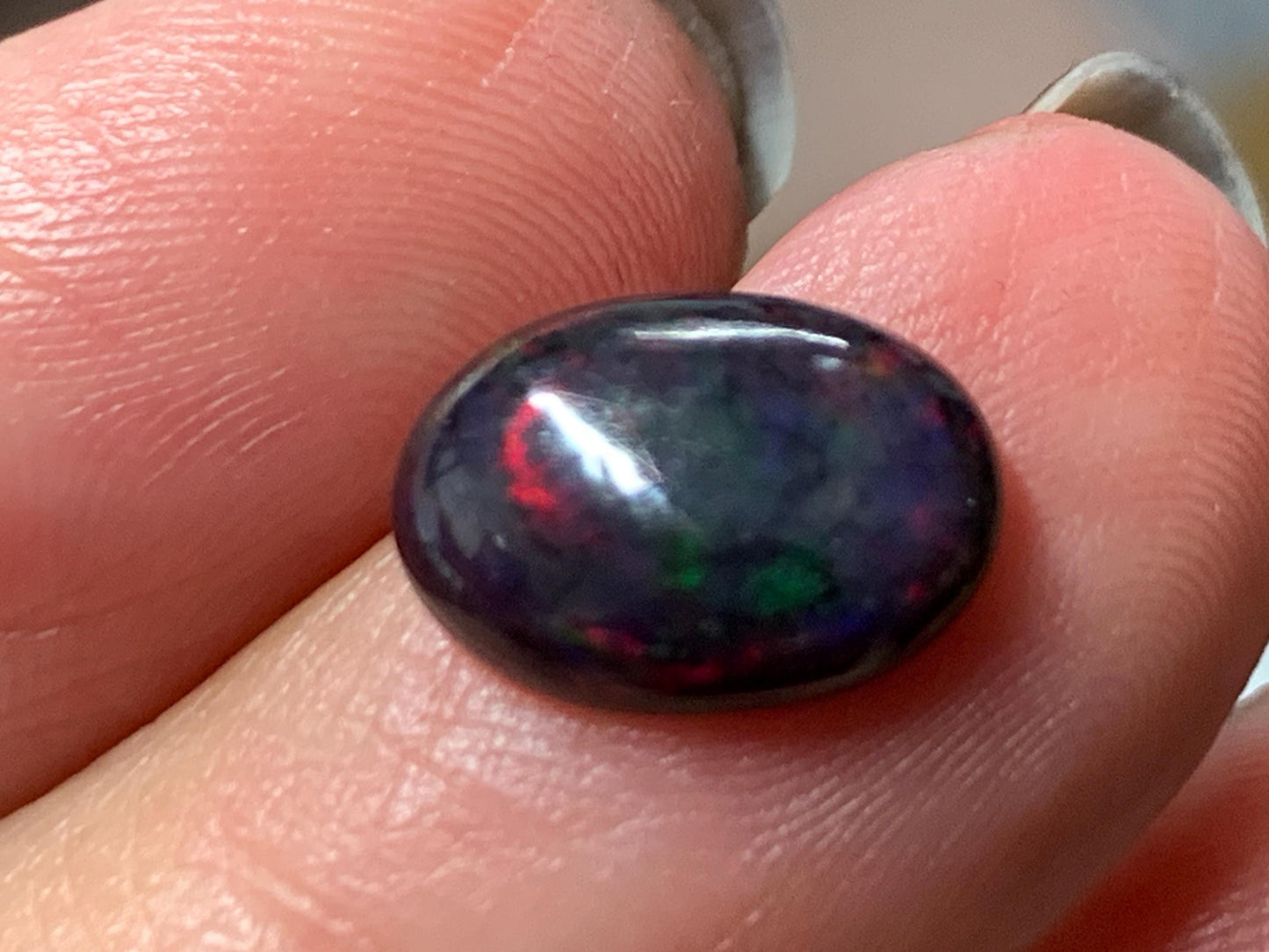 Natural Ethiopian Black Opal 9x11x5mm cabochon