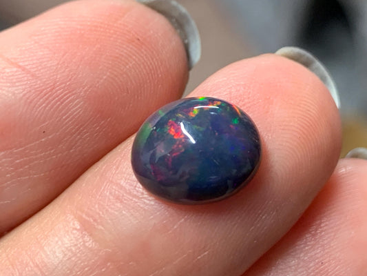 Natural Ethiopian Black Opal 8x11x4mm cabochon