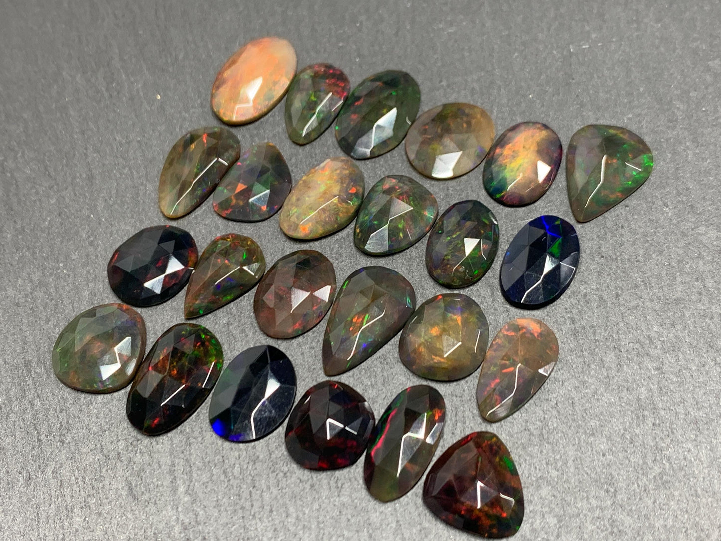 Faceted Black Ethiopian Opal 12-16mm long cabochon