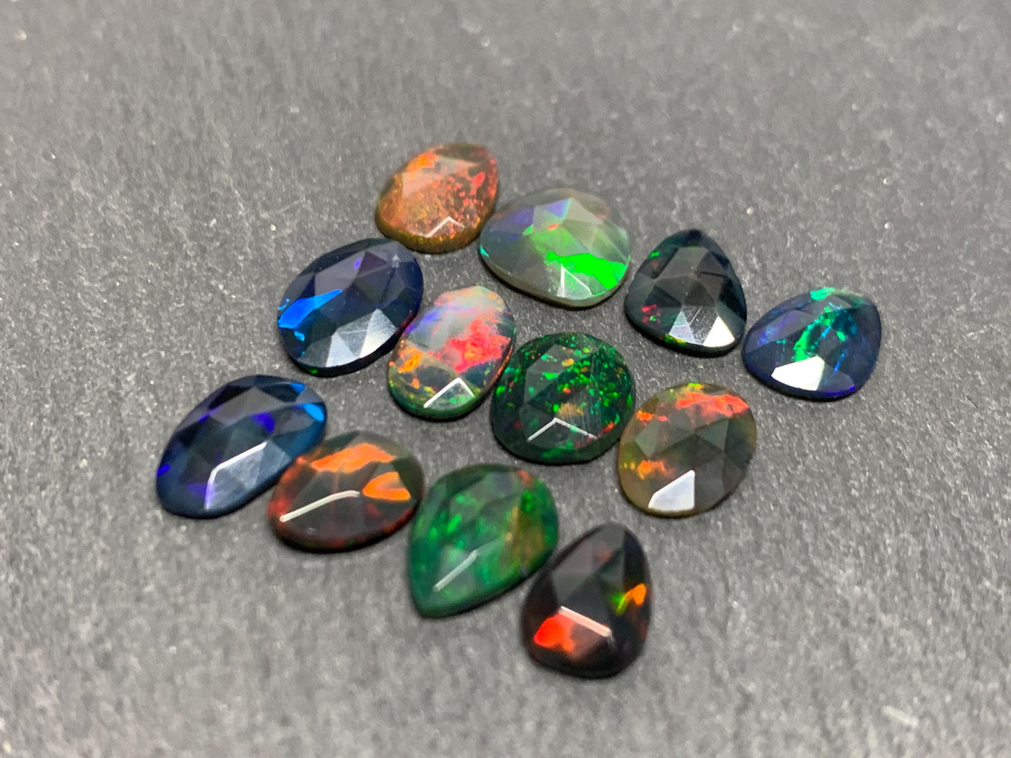 Faceted Black Opal free form 7-9mm long cabochon