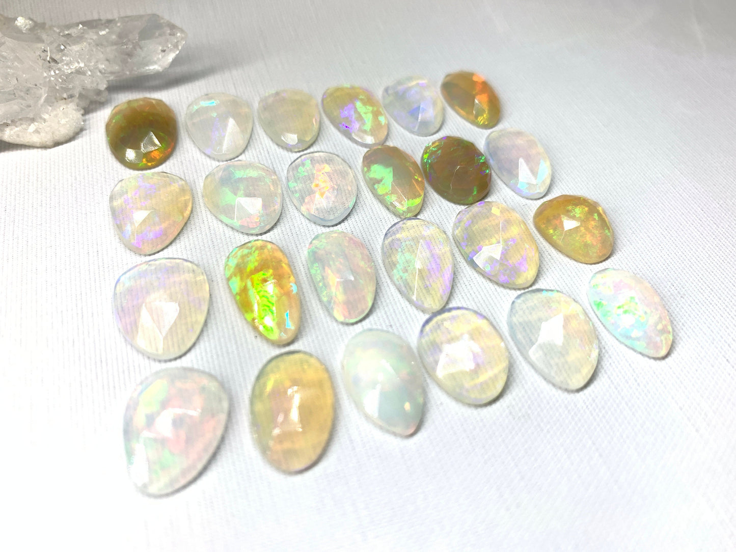 Faceted Ethiopian Opal 14-16mm cabochon