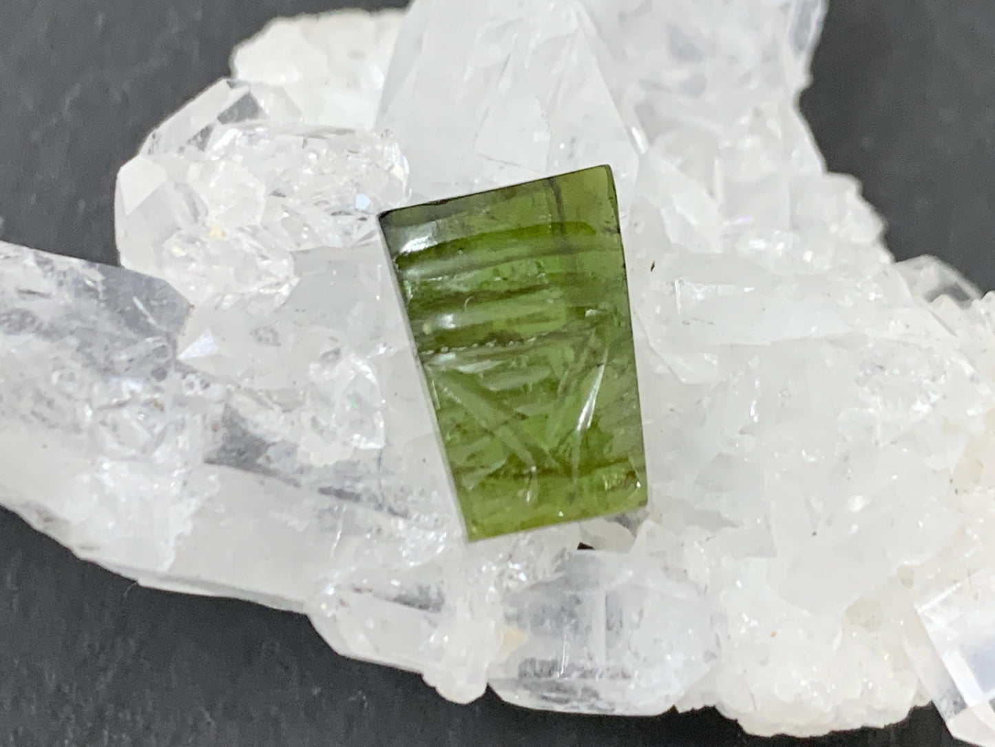 Carved Tourmaline 7x10x3mm cabochon