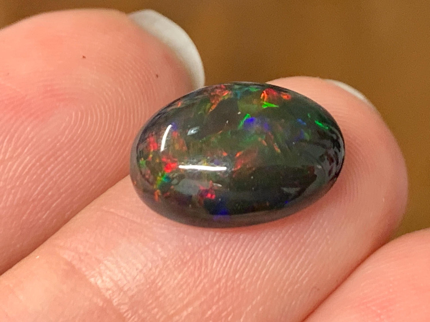 Natural Ethiopian Black Opal 10x13x5mm cabochon