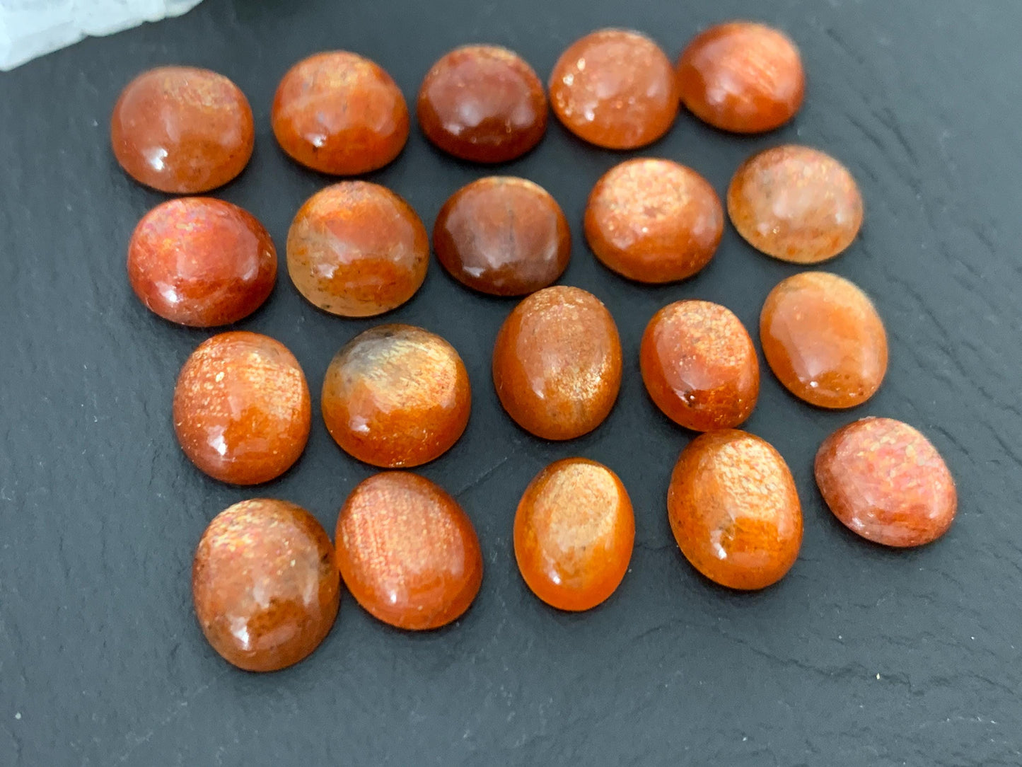 Sunstone round, oval 9-10mm long cabochon