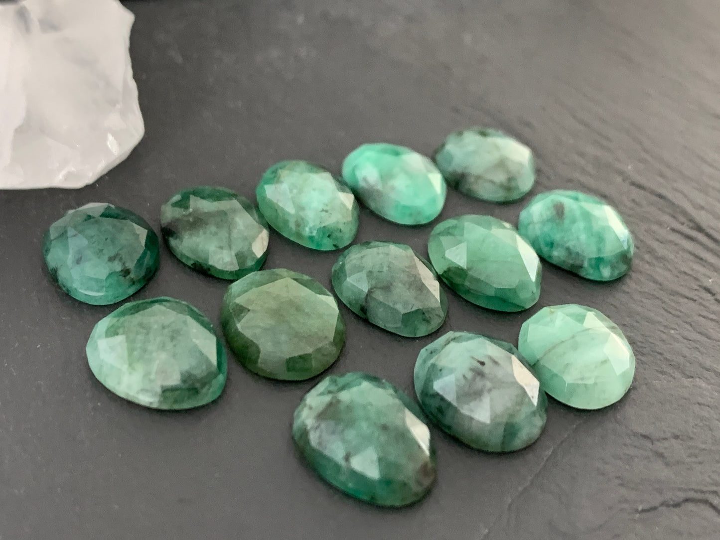 Faceted Emerald oval 12-13mm cabochon