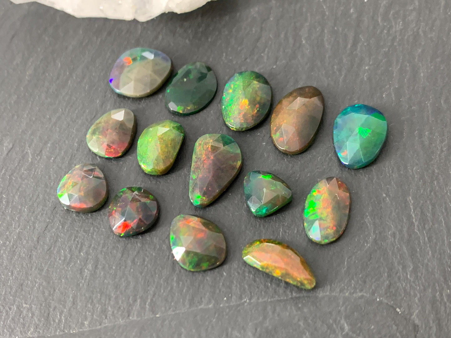 Faceted black Ethiopian Opal 8-12mm long cabochon