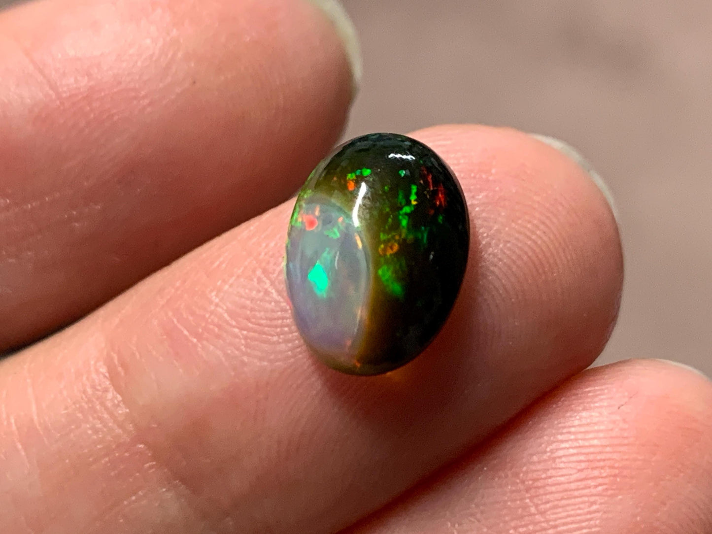 Natural Black Ethiopian Opal oval 8x11x4mm cabochon