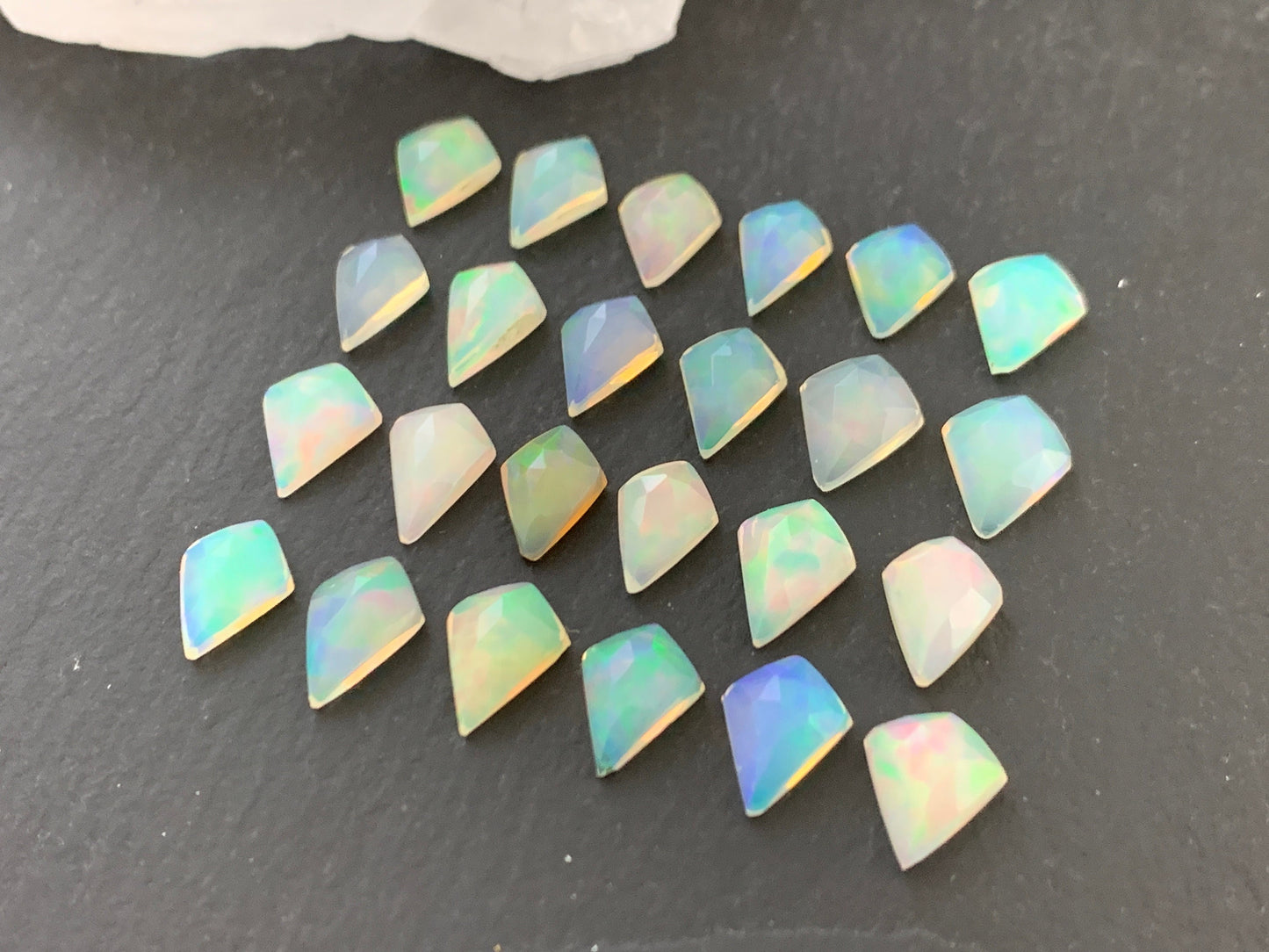 Faceted Welo Opal kite 7x9mm cabochon