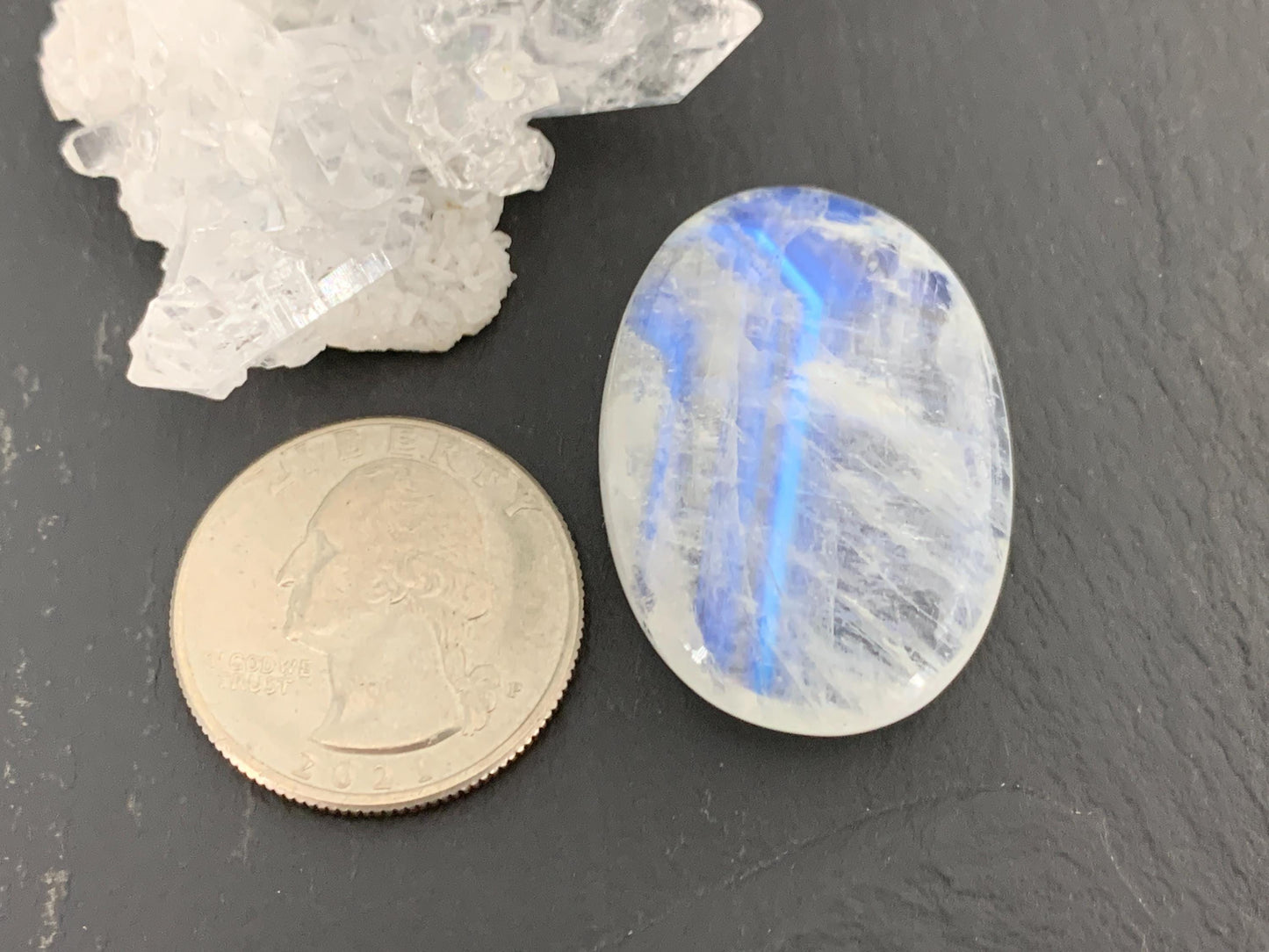 Rainbow Moonstone oval 35x24x9mm cabochon