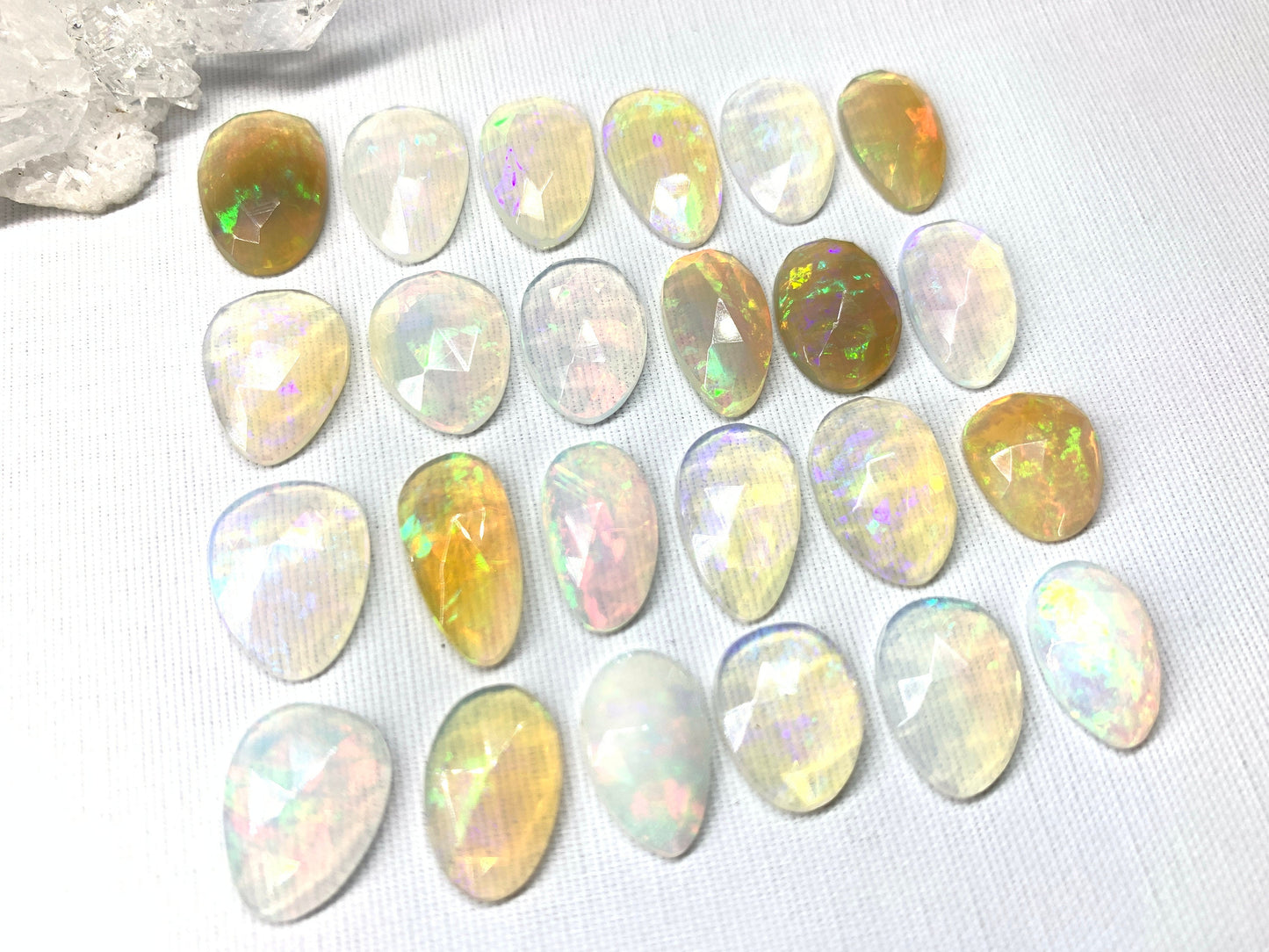 Faceted Ethiopian Opal 14-16mm cabochon