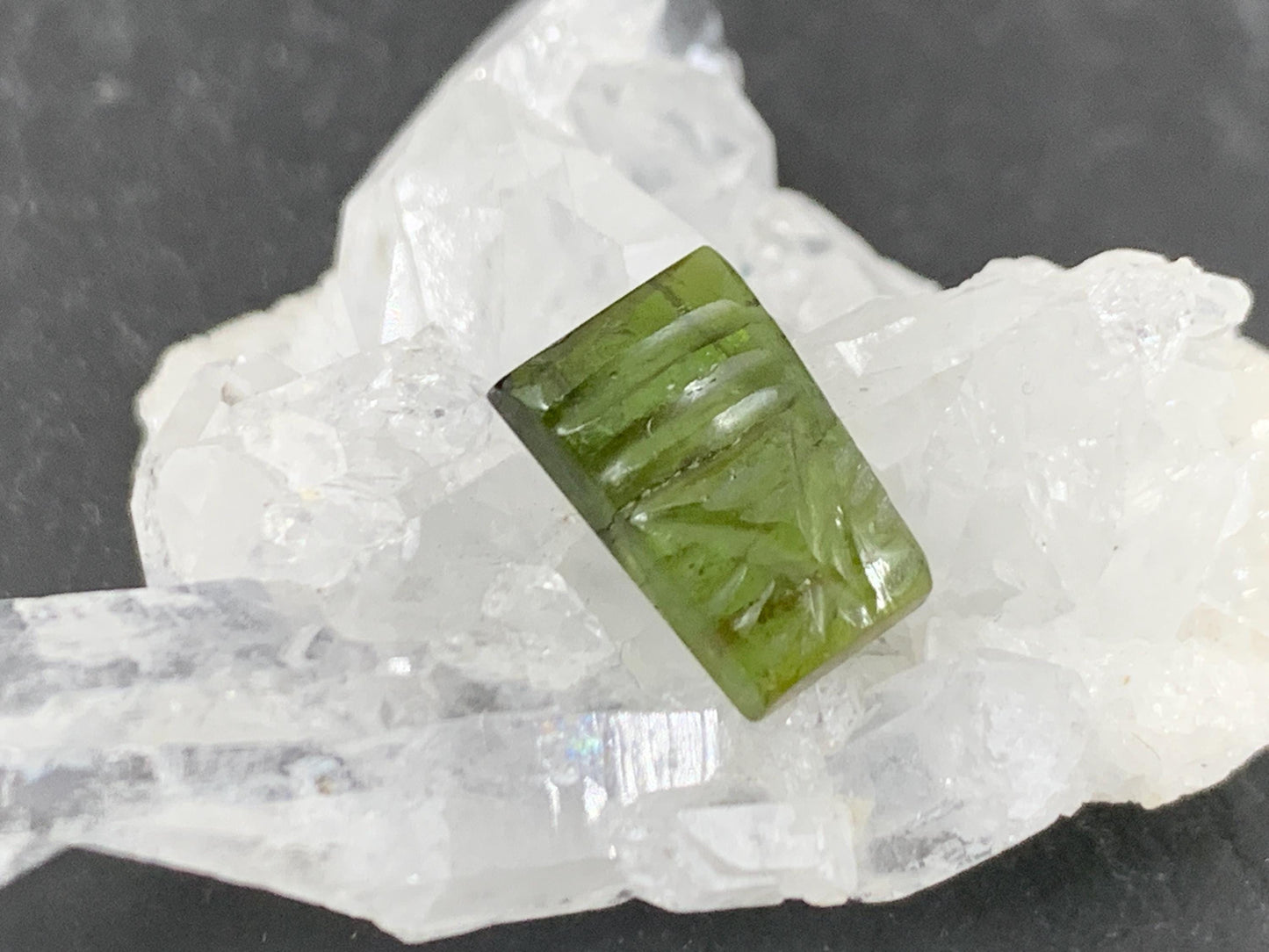 Carved Tourmaline 7x10x3mm cabochon