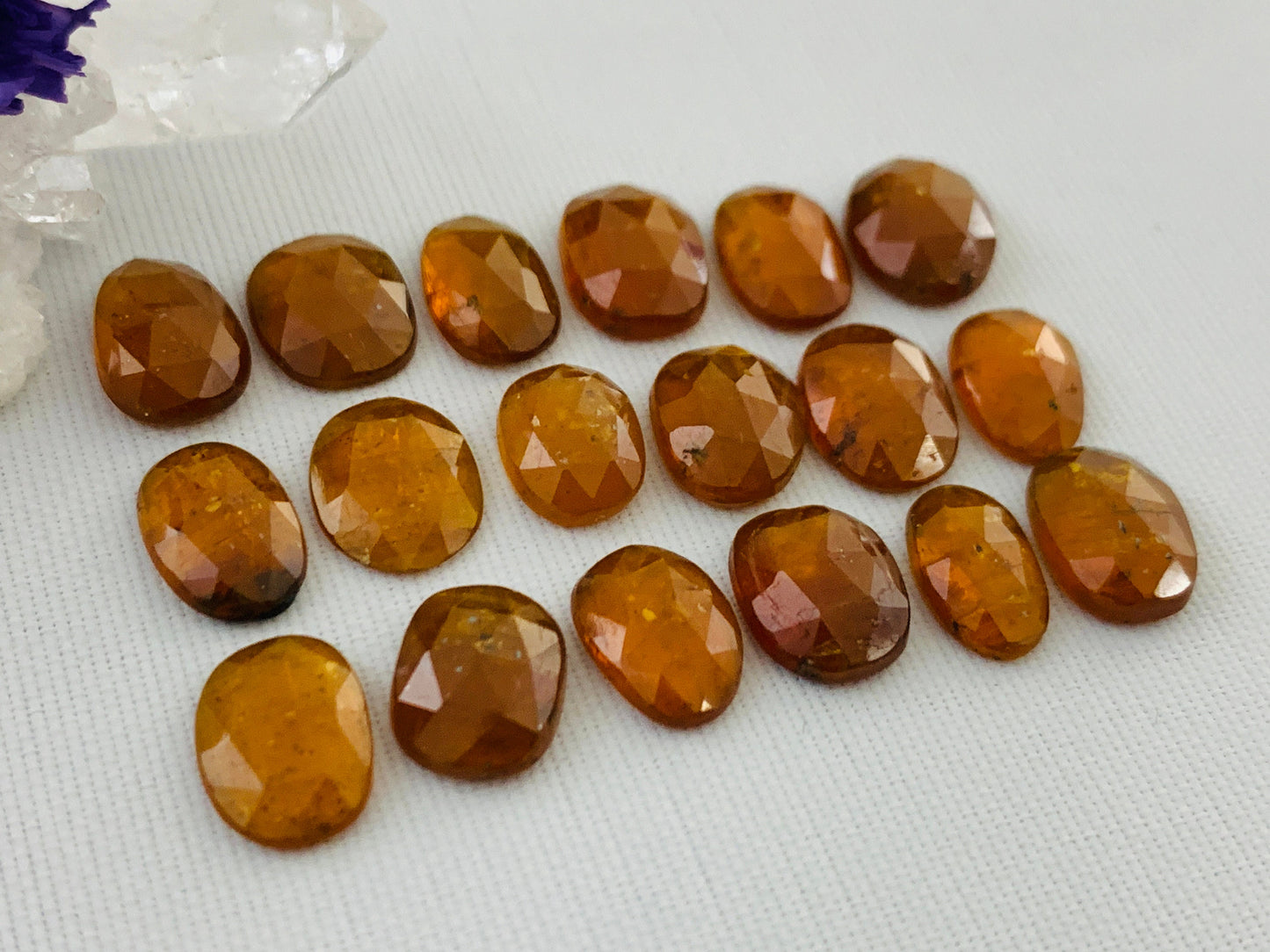 Faceted Orange Kyanite oval 9-10mm long cabochon