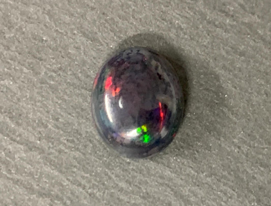 Natural Ethiopian Black Opal 9x11x5mm cabochon