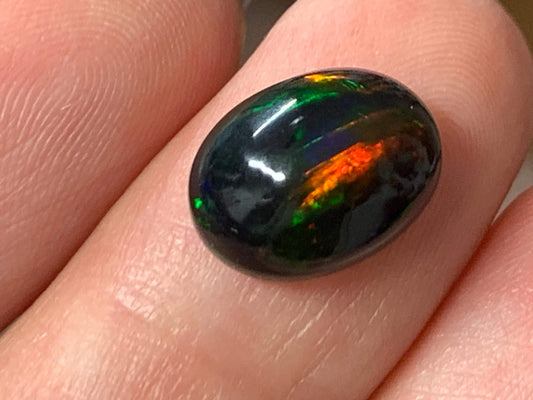 Natural Ethiopian Black Opal 9x12x5mm cabochon