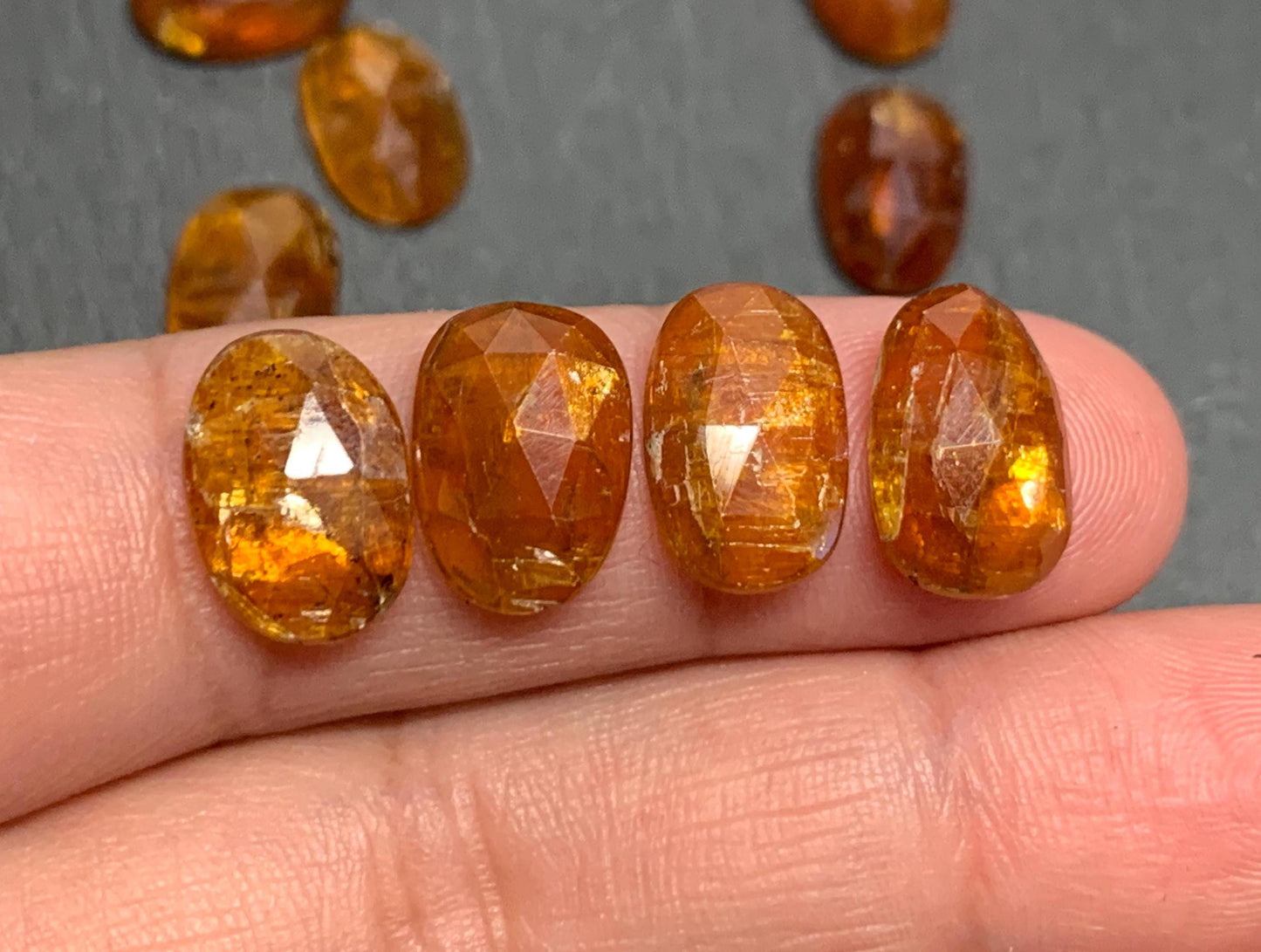 Damaged - faceted orange Kyanite oval 13mm long cabochons