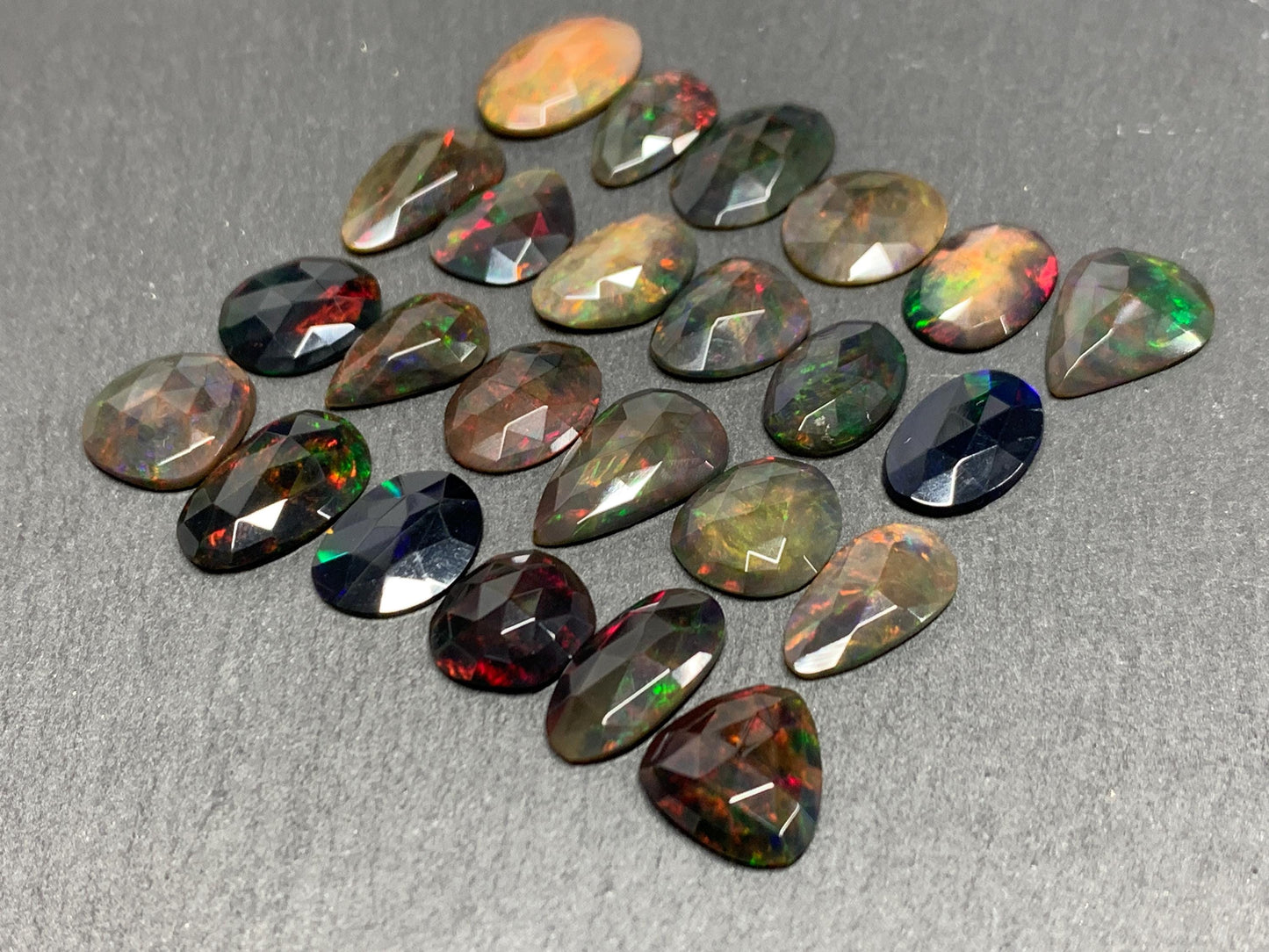 Faceted Black Ethiopian Opal 12-16mm long cabochon