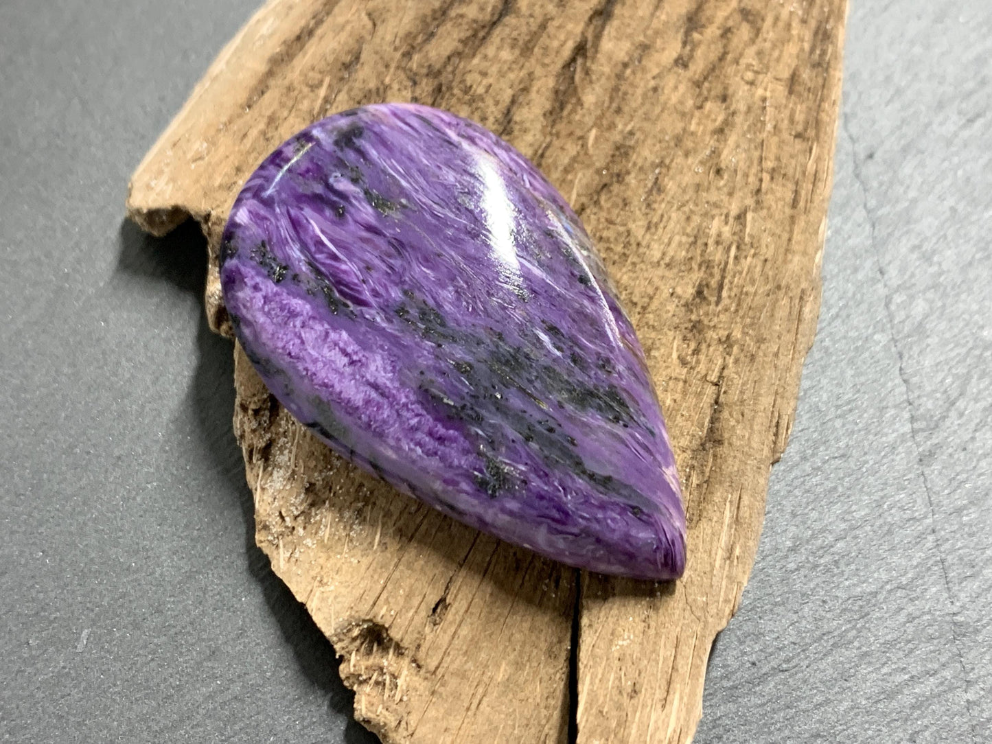 Charoite pear 50x30x7mm cabochon