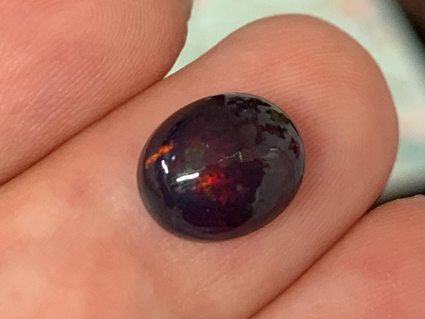 Natural Ethiopian Black Opal 8x10x5mm cabochon