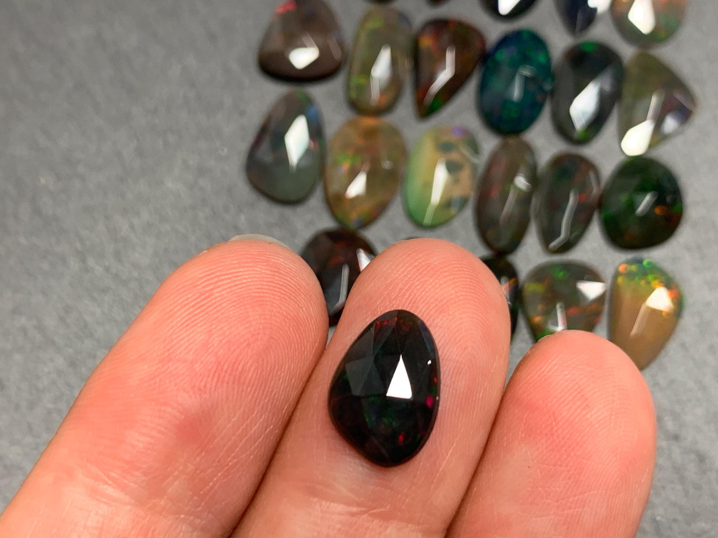 Faceted Black Opal 11-14mm long free form cabochon