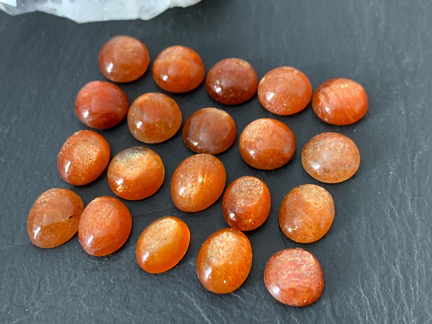 Sunstone round, oval 9-10mm long cabochon