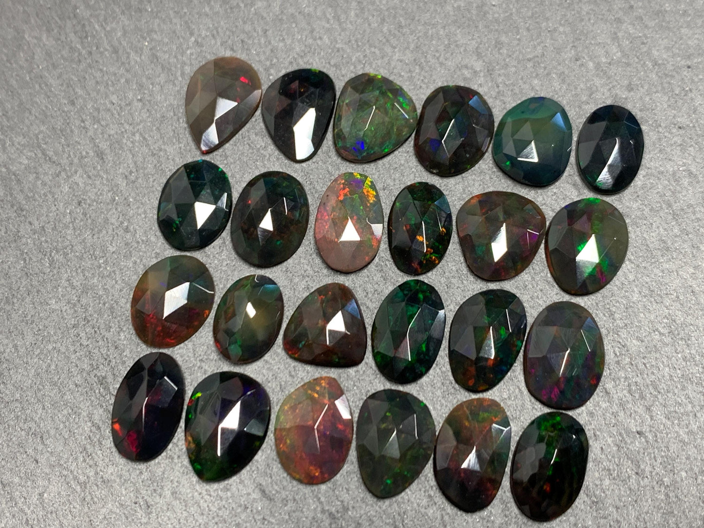 Faceted Black Ethiopian Opal 10-13mm long cabochon
