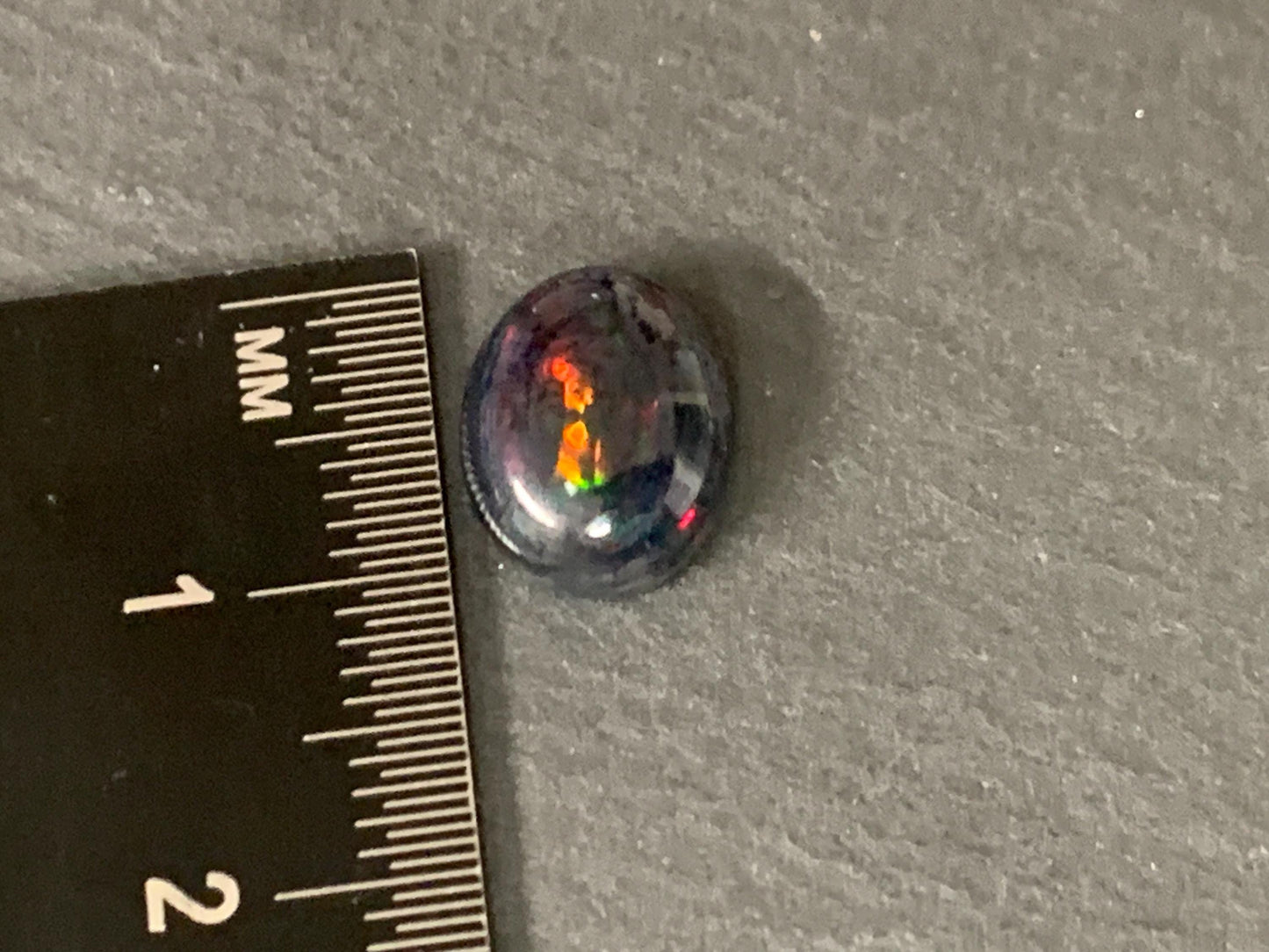 Black Ethiopian Opal 9x11x5mm cabochon