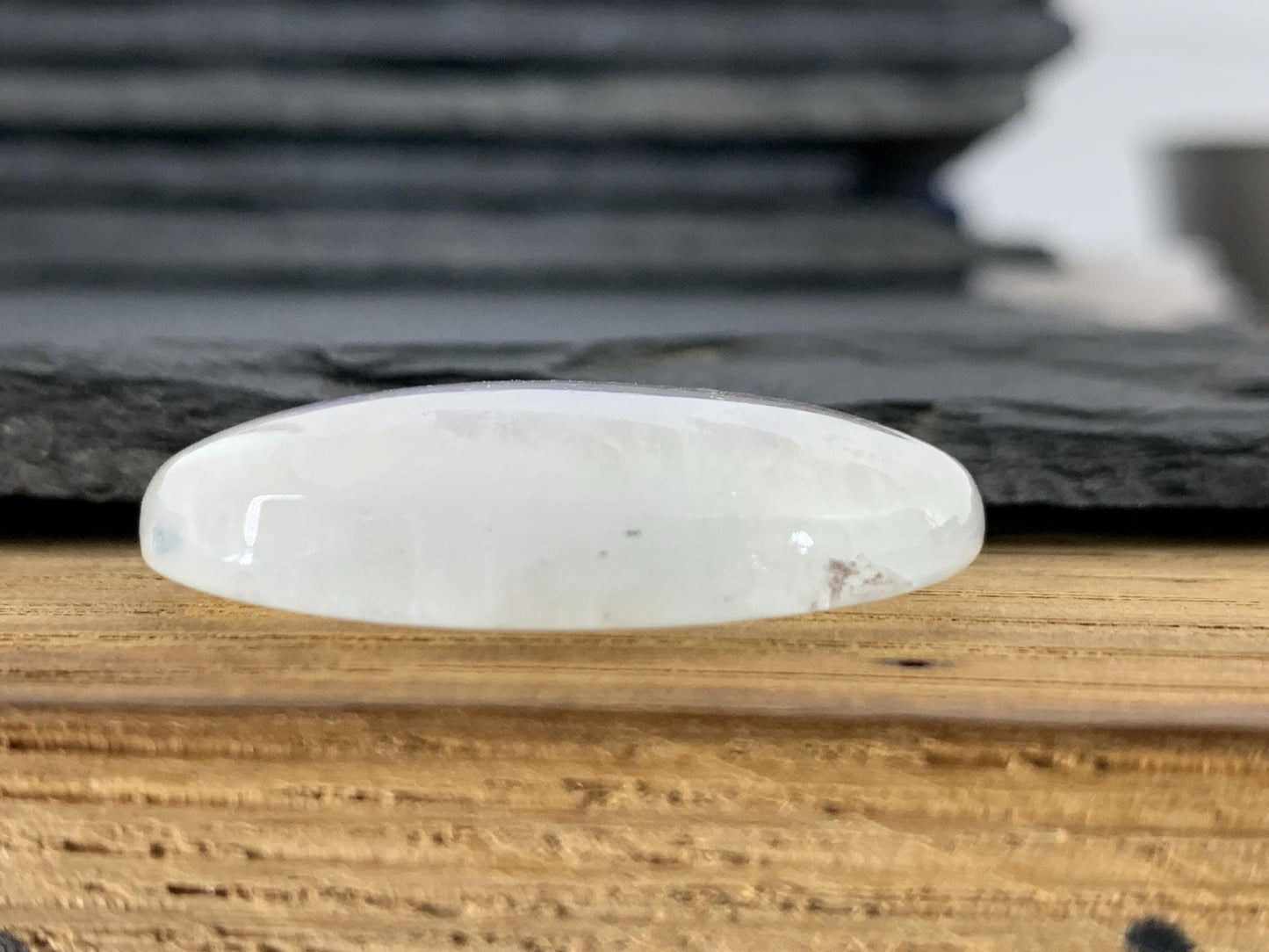 Rainbow Moonstone oval 35x24x9mm cabochon