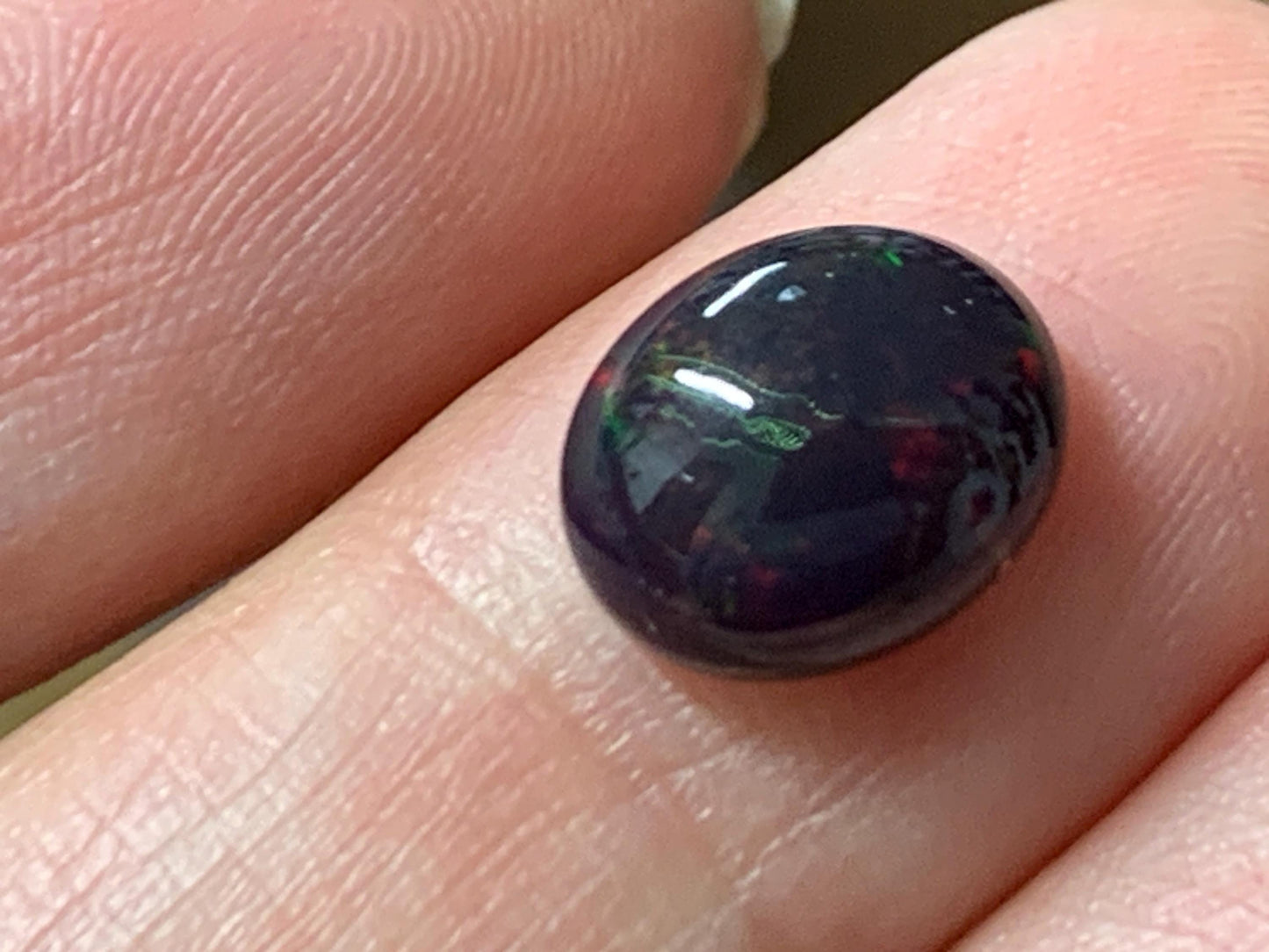 Natural Ethiopian Black Opal 8x10x5mm cabochon