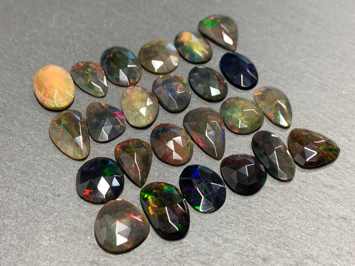 Faceted Black Ethiopian Opal 12-16mm long cabochon