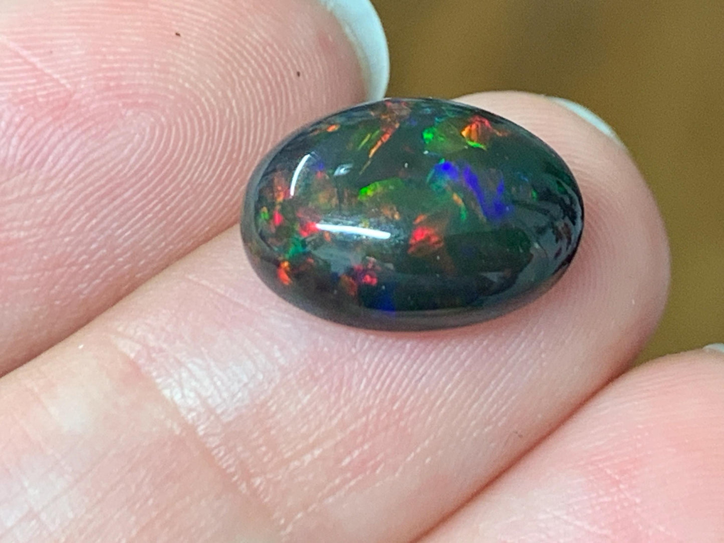 Natural Ethiopian Black Opal 10x13x5mm cabochon