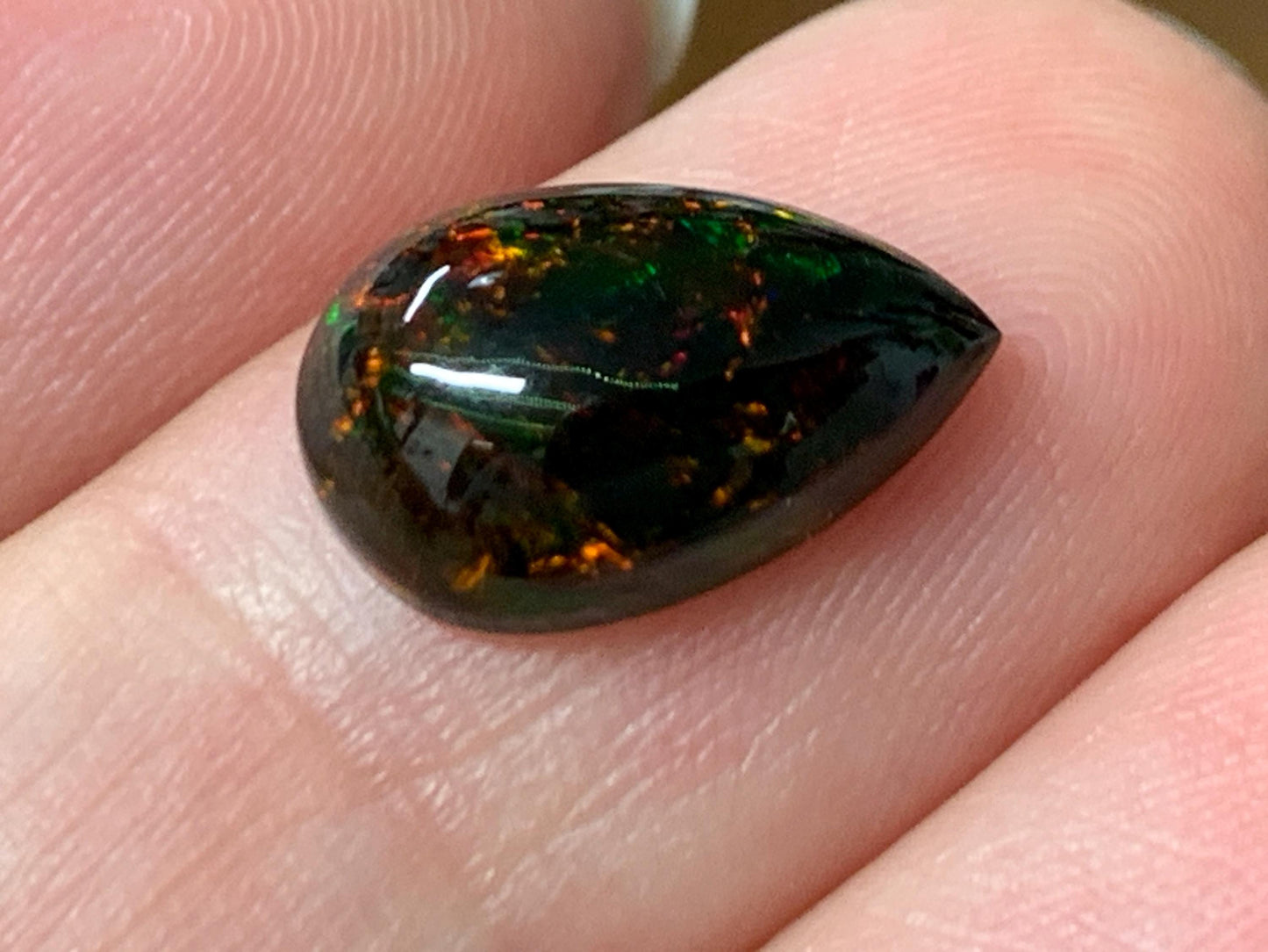 Natural Ethiopian Black Opal 8x12x4mm cabochon