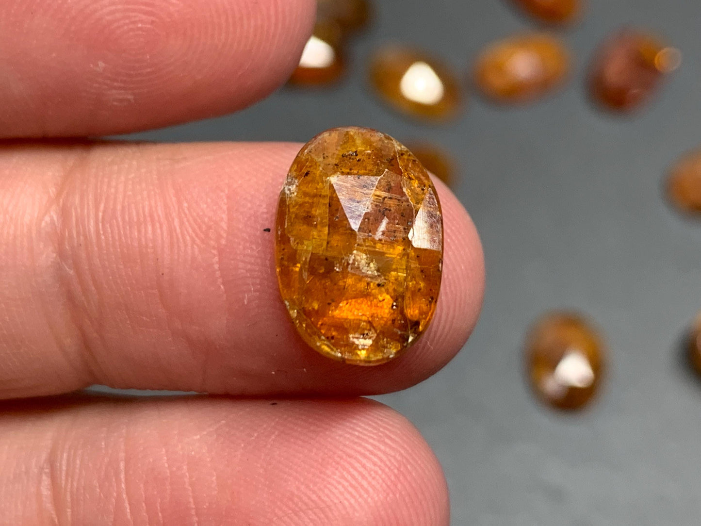 Damaged - faceted orange Kyanite oval 13mm long cabochons