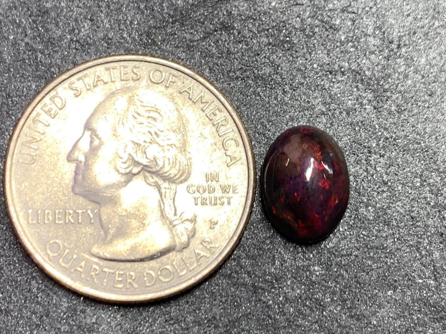 Black Ethiopian Opal oval 8x11x4.5mm cabochon.