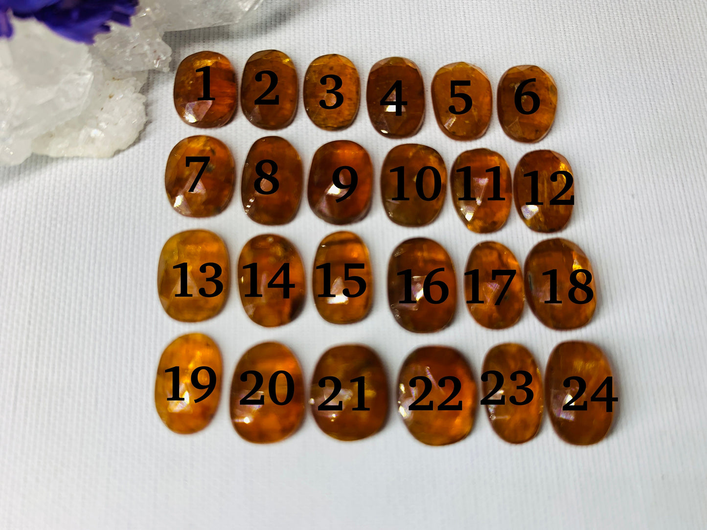 Faceted Orange Kyanite oval 10-11mm cabochon