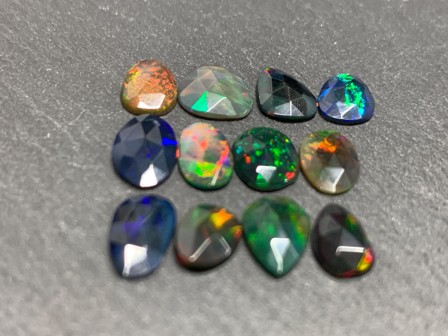 Faceted Black Opal free form 7-9mm long cabochon