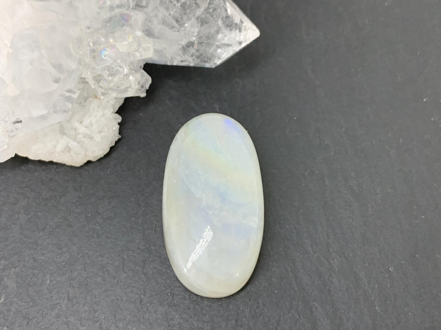 Rainbow Moonstone oval 23x12x7mm cabochon