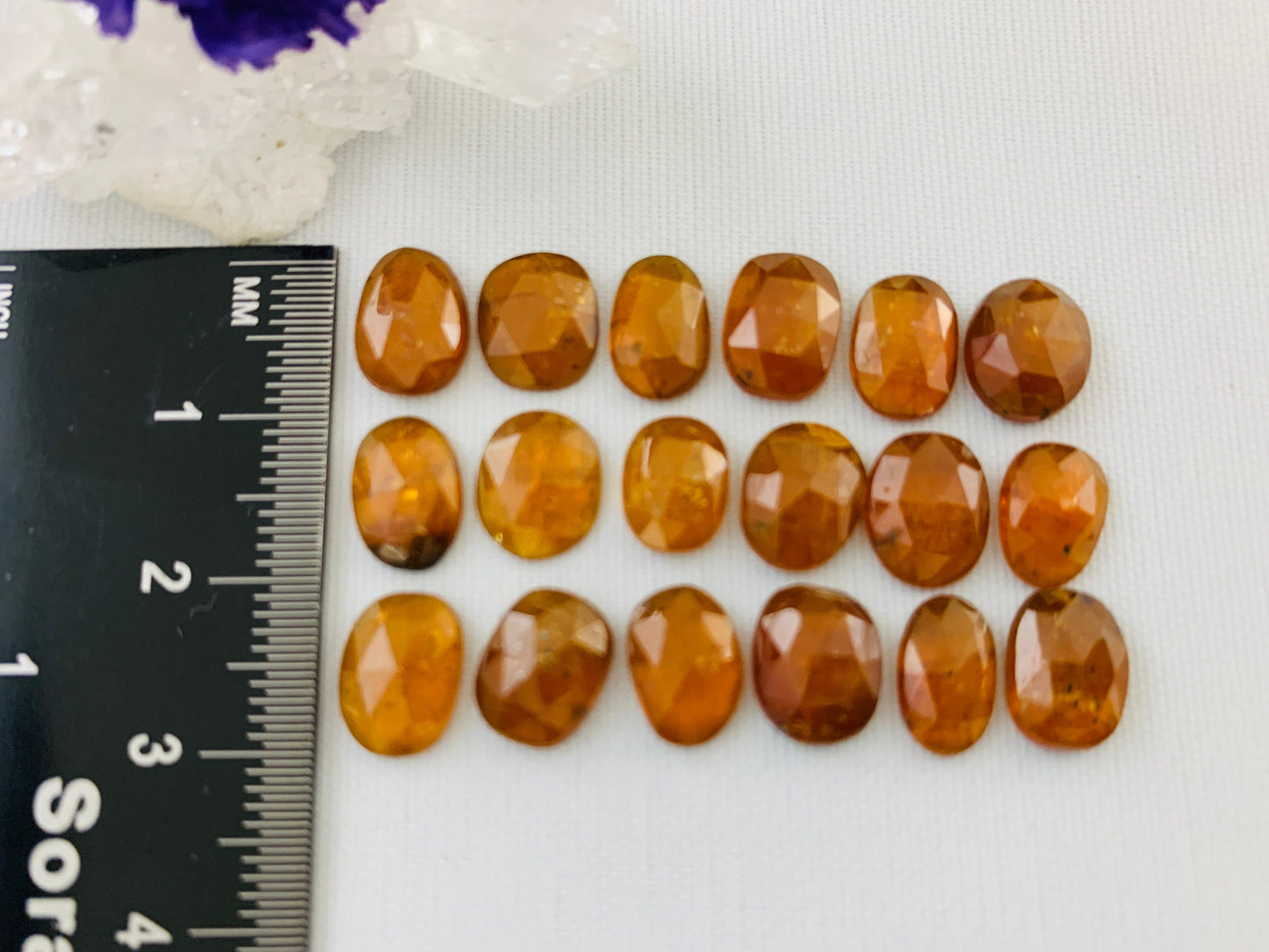 Faceted Orange Kyanite oval 9-10mm long cabochon