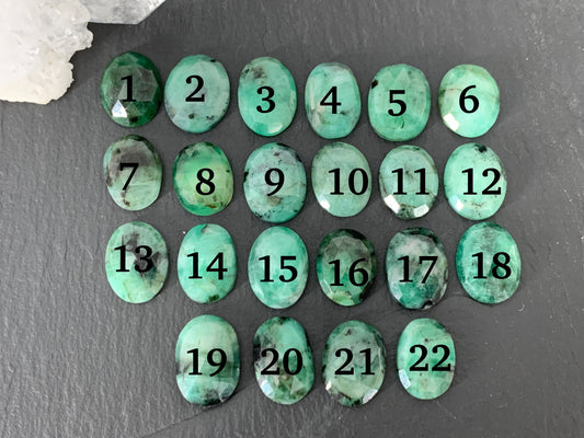 Faceted Emerald oval 13-14mm cabochon