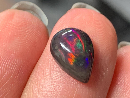 Natural Ethiopian Black Opal 7x11x4mm cabochon