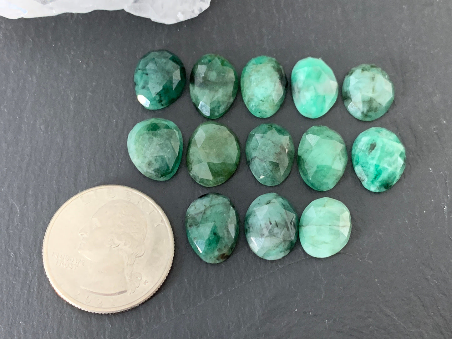 Faceted Emerald oval 12-13mm cabochon