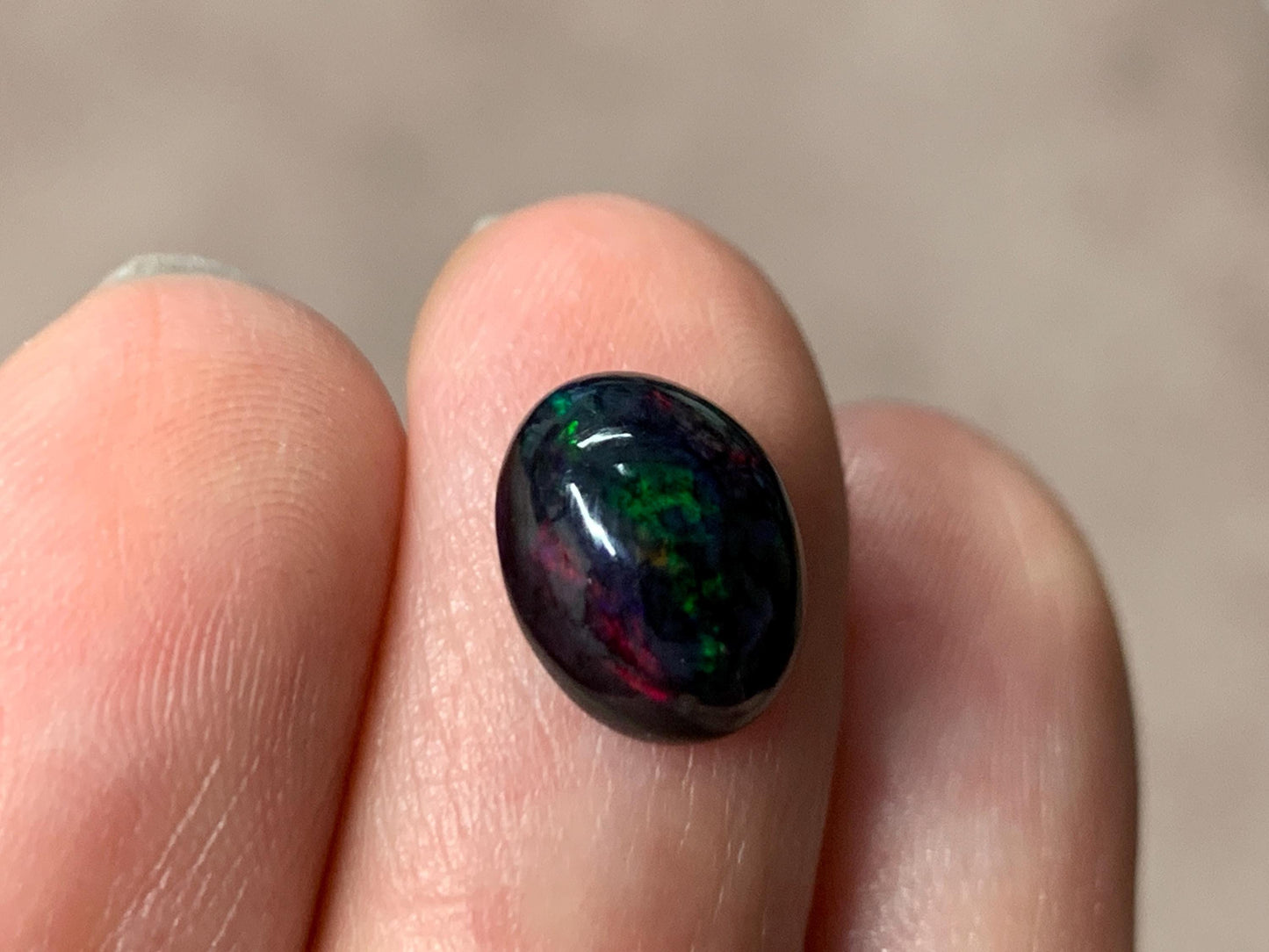 Black Ethiopian Opal oval 8x11x5mm cabochon