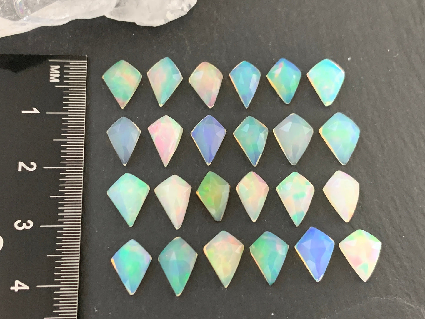 Faceted Welo Opal kite 7x9mm cabochon