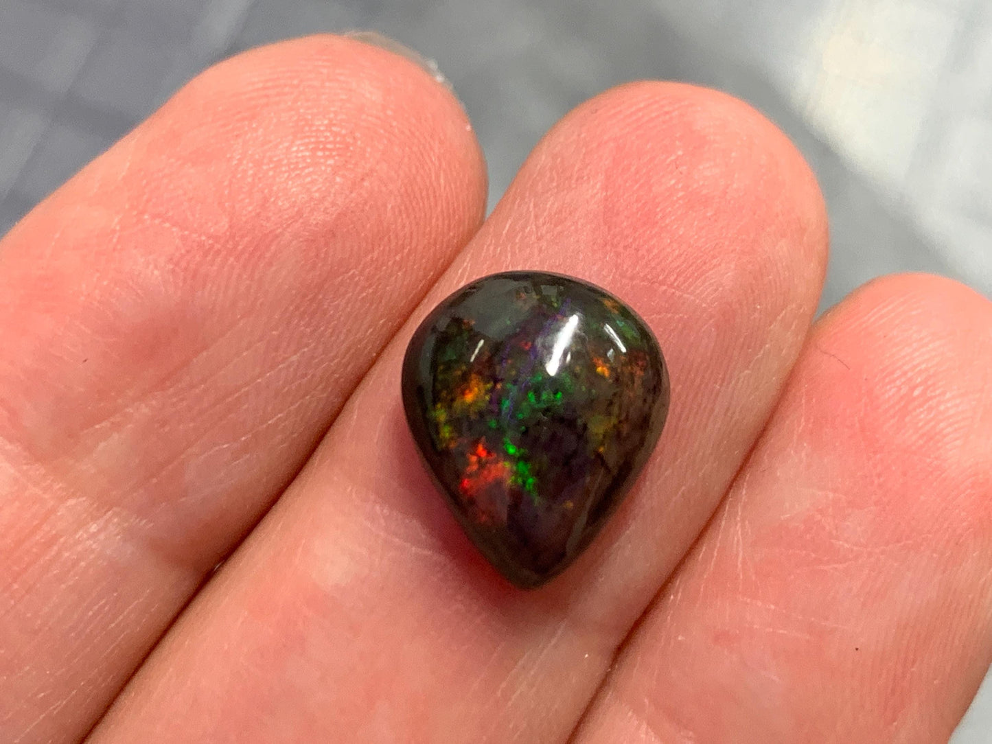 Black Ethiopian Opal pear 10x12x4mm cabochon