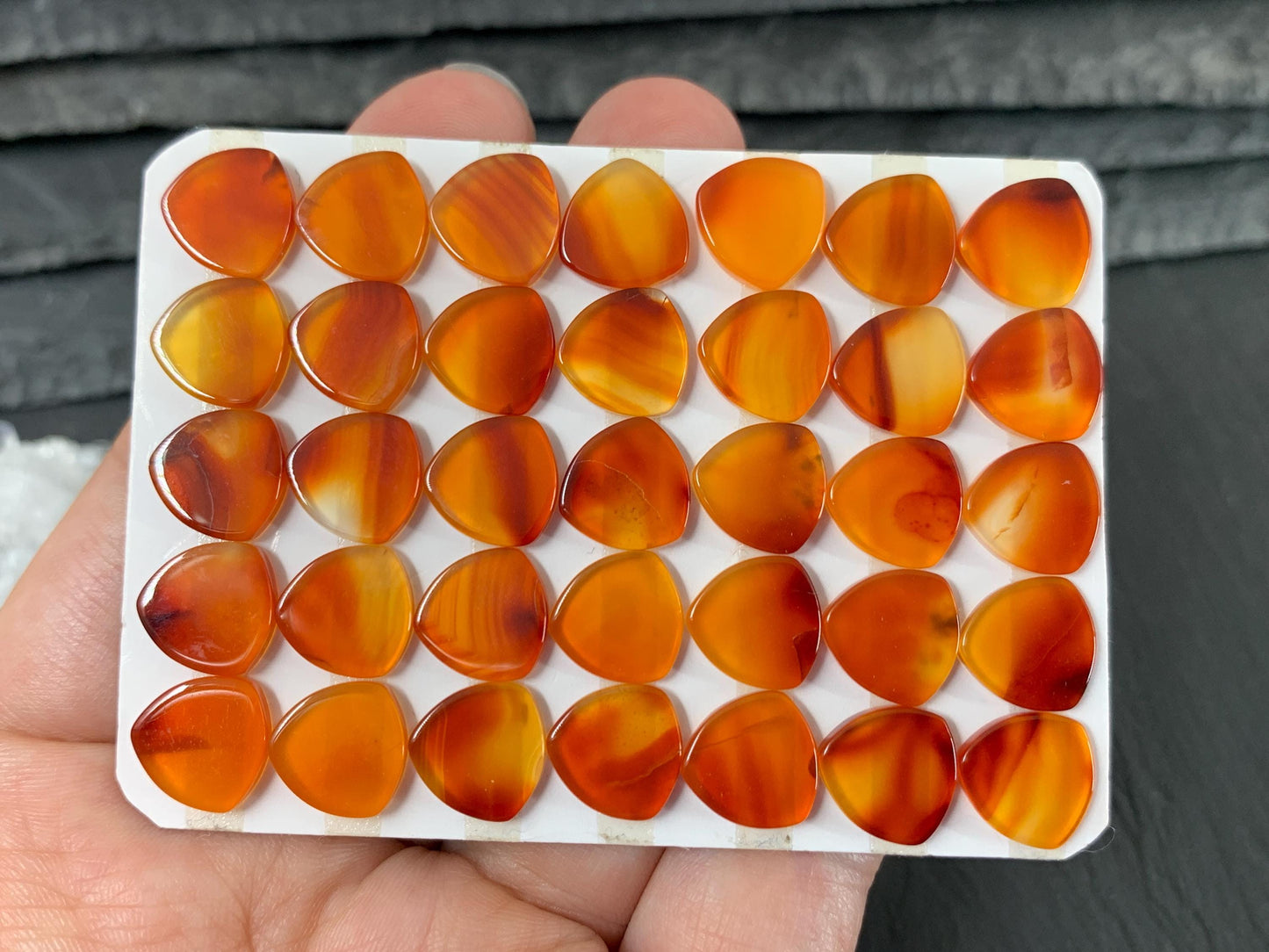 Flat Carnelian curved triangle 10mm cabochon - Calibrated cabochons