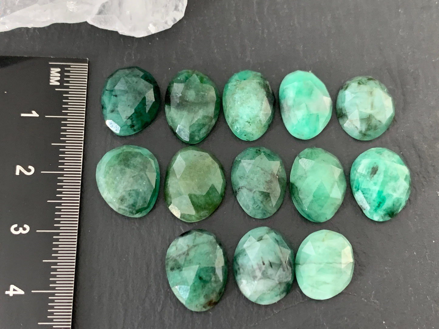 Faceted Emerald oval 12-13mm cabochon
