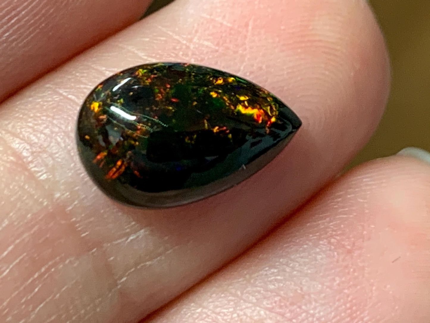 Natural Ethiopian Black Opal 8x12x4mm cabochon