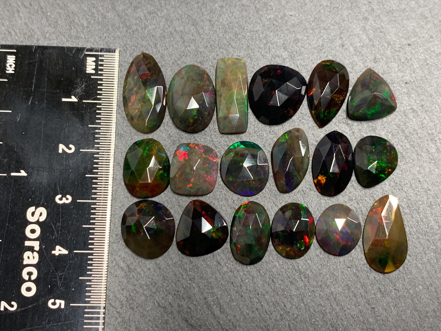 Faceted Black Opal oval 10-16mm long cabochon