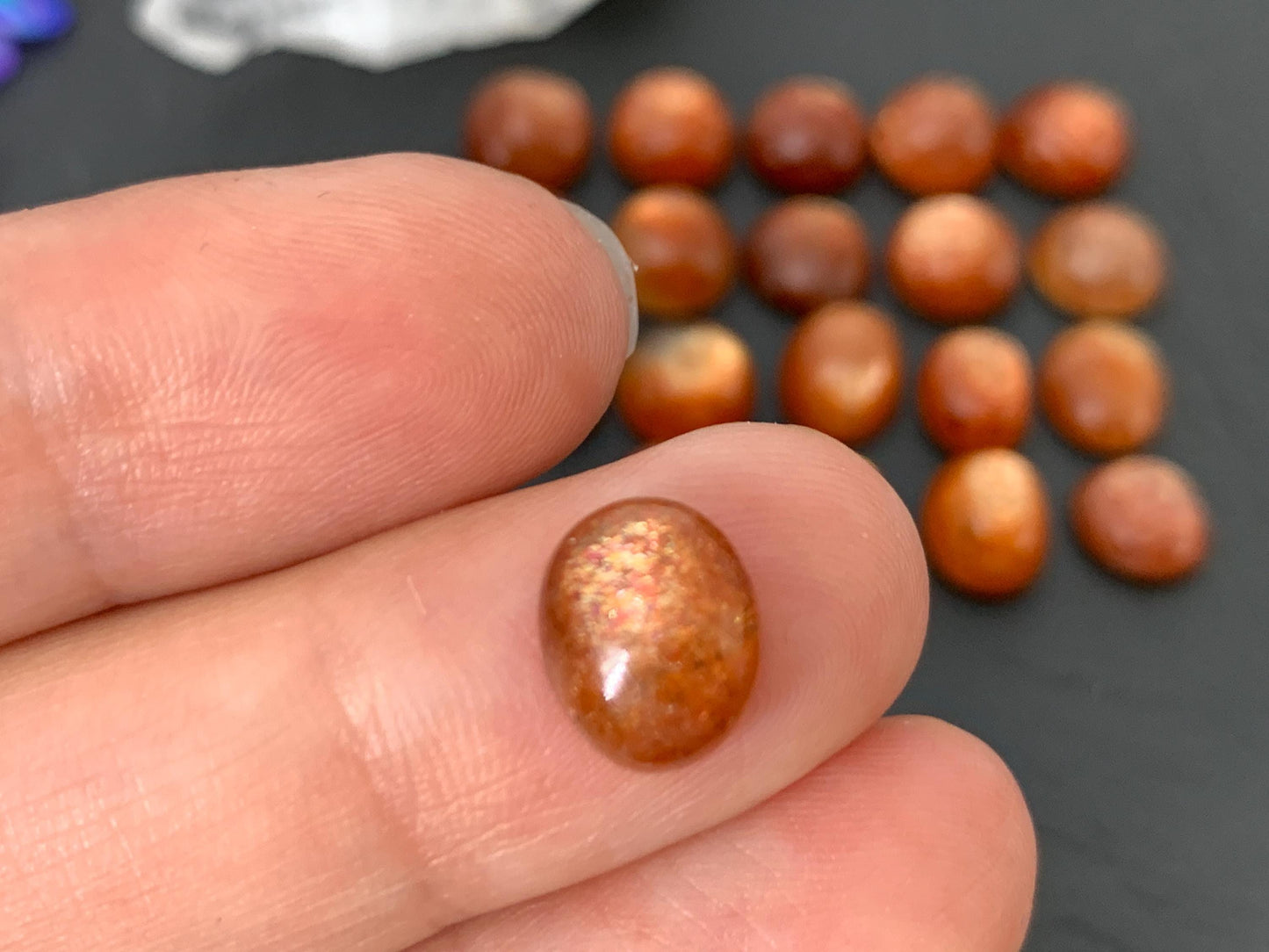 Sunstone round, oval 9-10mm long cabochon