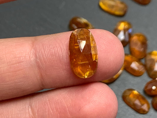 Damaged - damaged faceted orange Kyanite oval 8x13mm cabochons