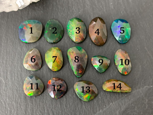 Faceted black Ethiopian Opal 8-12mm long cabochon